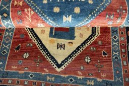 Full view of 2000s Persian Gabbeh rug from Iran / Persia, 190 × 107 cm in Red tones
