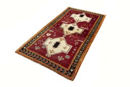 Corner detail of 2000s Persian Gabbeh rug showing border pattern and Wool pile