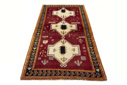 Surface texture of 2000s Persian Gabbeh rug with natural Wool and intricate pattern
