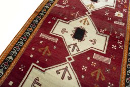 Backside of handmade 2000s Persian Gabbeh rug showing knot structure and weave density