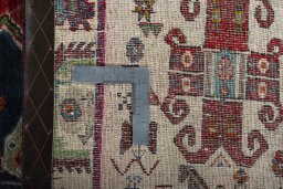 Surface texture of 2000s Persian Gabbeh rug with natural Wool and intricate pattern