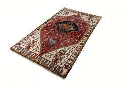 Corner detail of 2000s Persian Gabbeh rug showing border pattern and Wool pile