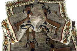Corner detail of 2000s Persian Gabbeh rug showing border pattern and Wool pile