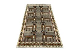 Surface texture of 2000s Persian Gabbeh rug with natural Wool and intricate pattern