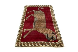Surface texture of 2000s Persian Gabbeh rug with natural Wool and intricate pattern
