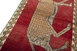 Backside of handmade 2000s Persian Gabbeh rug showing knot structure and weave density