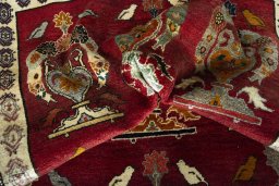 Corner detail of 2000s Persian Gabbeh rug showing border pattern and Wool pile