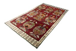 Corner detail of 2000s Persian Gabbeh rug showing border pattern and Wool pile