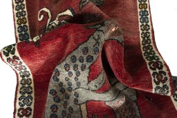 Corner detail of 2000s Persian Gabbeh rug showing border pattern and Wool pile