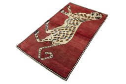 Corner detail of 2000s Persian Gabbeh rug showing border pattern and Wool pile