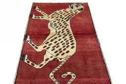 Surface texture of 2000s Persian Gabbeh rug with natural Wool and intricate pattern