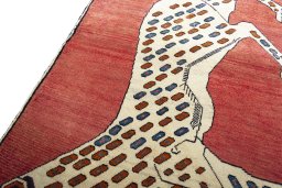 Backside of handmade 2000s Persian Gabbeh rug showing knot structure and weave density