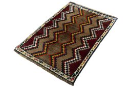 Corner detail of 2000s Persian Gabbeh rug showing border pattern and Wool pile