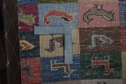 Close-up detail of 2000s Persian Gabbeh rug from Iran / Persia showing Wool weave