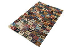 Corner detail of 2000s Persian Gabbeh rug showing border pattern and Wool pile