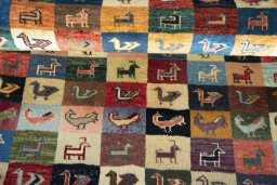 Full view of 2000s Persian Gabbeh rug from Iran / Persia, 124 × 83 cm in Multi Color tones