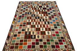 Surface texture of 2000s Persian Gabbeh rug with natural Wool and intricate pattern