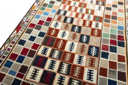 Backside of handmade 2000s Persian Gabbeh rug showing knot structure and weave density
