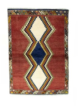 Full view of 2000s Persian Gabbeh rug from Iran / Persia, 135 × 94 cm in Red tones