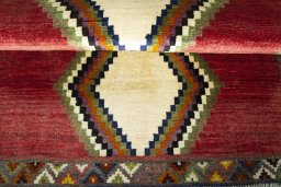 Full view of 2000s Persian Gabbeh rug from Iran / Persia, 135 × 94 cm in Red tones