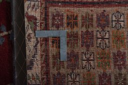 Surface texture of 2000s Persian Gabbeh rug with natural Wool and intricate pattern