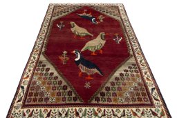 Surface texture of 2000s Persian Gabbeh rug with natural Wool and intricate pattern