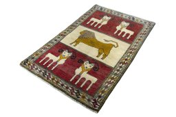 Corner detail of 2000s Persian Gabbeh rug showing border pattern and Wool pile
