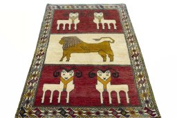 Surface texture of 2000s Persian Gabbeh rug with natural Wool and intricate pattern