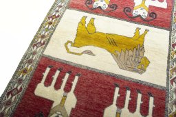 Backside of handmade 2000s Persian Gabbeh rug showing knot structure and weave density