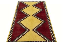 Surface texture of 2000s Persian Gabbeh rug with natural Wool and intricate pattern
