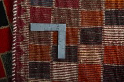 Close-up detail of 2000s Persian Gabbeh rug from Iran / Persia showing Wool weave