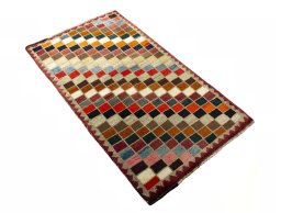 Close-up detail of 2000s Persian Gabbeh rug from Iran / Persia showing Wool weave