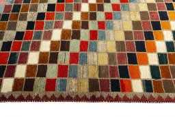 Close-up detail of 2000s Persian Gabbeh rug from Iran / Persia showing Wool weave