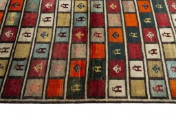 Close-up detail of 2000s Persian Gabbeh rug from Iran / Persia showing Wool weave