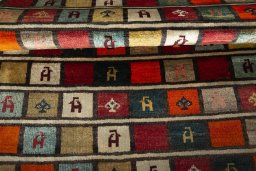 Full view of 2000s Persian Gabbeh rug from Iran / Persia, 187 × 101 cm in Multi Color tones