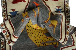 Corner detail of 2000s Persian Gabbeh rug showing border pattern and Wool pile