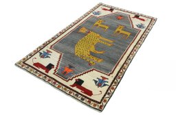 Corner detail of 2000s Persian Gabbeh rug showing border pattern and Wool pile