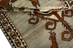 Corner detail of 2000s Persian Gabbeh rug showing border pattern and Wool pile