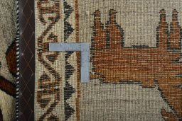 Surface texture of 2000s Persian Gabbeh rug with natural Wool and intricate pattern