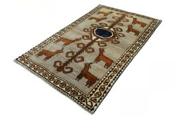 Corner detail of 2000s Persian Gabbeh rug showing border pattern and Wool pile