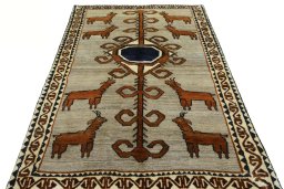 Surface texture of 2000s Persian Gabbeh rug with natural Wool and intricate pattern