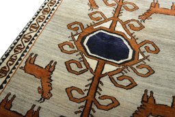 Backside of handmade 2000s Persian Gabbeh rug showing knot structure and weave density