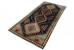 Corner detail of 2000s Persian Gabbeh rug showing border pattern and Wool pile
