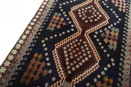 Backside of handmade 2000s Persian Gabbeh rug showing knot structure and weave density