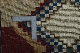 Corner detail of 2000s Persian Gabbeh rug showing border pattern and Wool pile