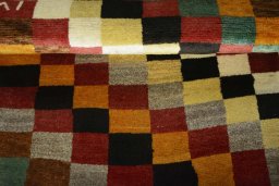 Full view of 2000s Persian Gabbeh rug from Iran / Persia, 143 × 82 cm in Multi Color tones