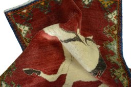 Corner detail of 2000s Persian Gabbeh rug showing border pattern and Wool pile