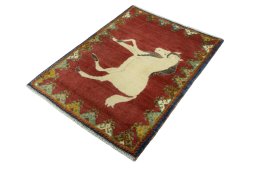 Corner detail of 2000s Persian Gabbeh rug showing border pattern and Wool pile