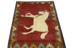 Surface texture of 2000s Persian Gabbeh rug with natural Wool and intricate pattern