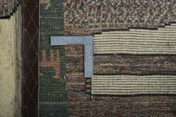 Close-up detail of 2000s Persian Gabbeh rug from Iran / Persia showing Wool weave